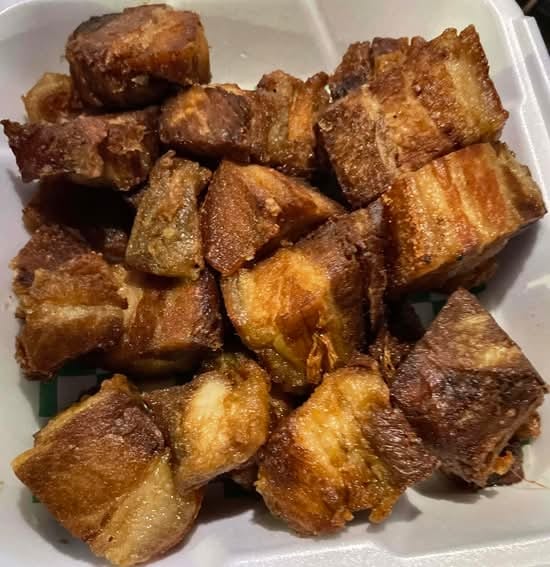 Dinuguan topped with Lechon Kawali.
